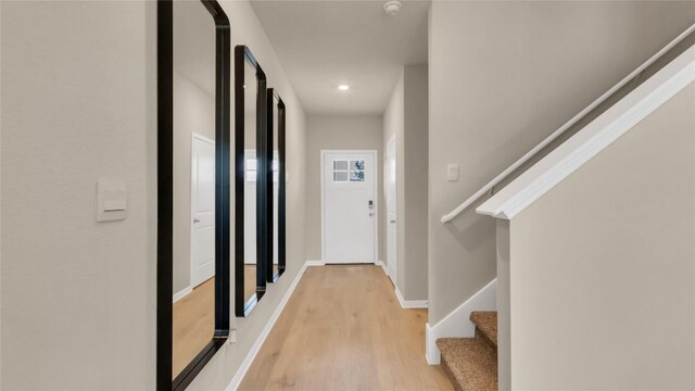 100 Heatherwood Ter, Marble Falls, TX 78654 - corridor with light wood-type flooring, stairs, baseboards, and recessed lighting