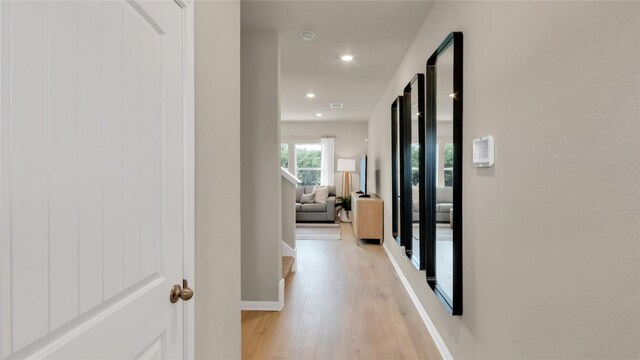 100 Heatherwood Ter, Marble Falls, TX 78654 - hall with light wood-style flooring, baseboards, and recessed lighting
