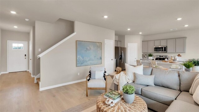 100 Heatherwood Ter, Marble Falls, TX 78654 - living area featuring stairs, recessed lighting, light wood finished floors, and baseboards