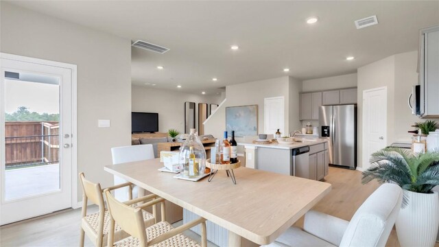 100 Heatherwood Ter, Marble Falls, TX 78654 - dining room with light wood-style floors and recessed lighting