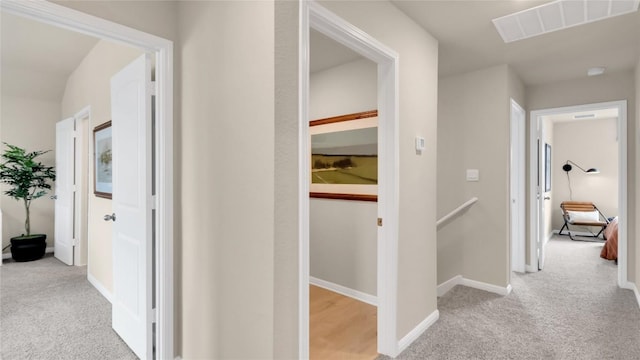 100 Heatherwood Ter, Marble Falls, TX 78654 - hallway featuring carpet flooring, an upstairs landing, and baseboards