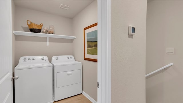 100 Heatherwood Ter, Marble Falls, TX 78654 - laundry area with separate washer and dryer and light wood-type flooring