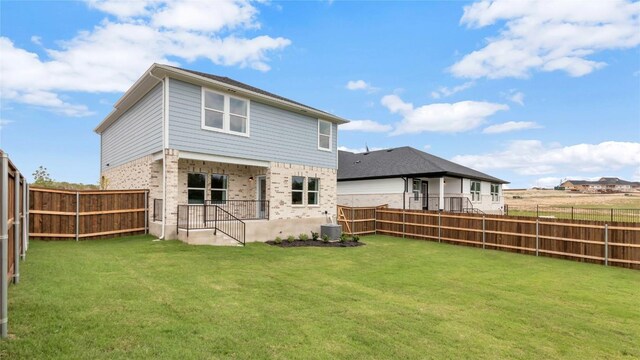 100 Heatherwood Ter, Marble Falls, TX 78654 - rear view of property with brick siding and central AC unit