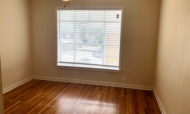 301 E 34th St Unit 107, Austin, TX 78705 - empty room with wood finished floors and baseboards