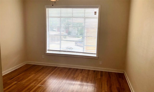 301 E 34th St Unit 107, Austin, TX 78705 - empty room featuring wood finished floors and baseboards