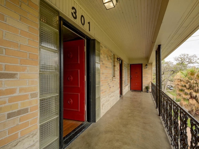 301 E 34th St Unit 107, Austin, TX 78705 - doorway to property featuring brick siding