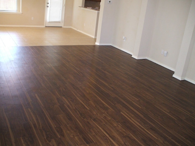 10506 Wylie Dr Unit 276, Austin, TX 78748 - empty room featuring baseboards and dark wood-type flooring