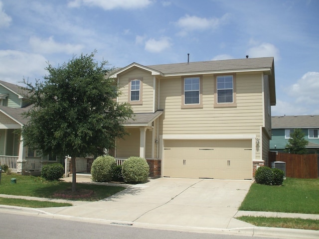 10506 Wylie Dr Unit 276, Austin, TX 78748 - view of front of home featuring driveway, brick siding, a garage, and central AC