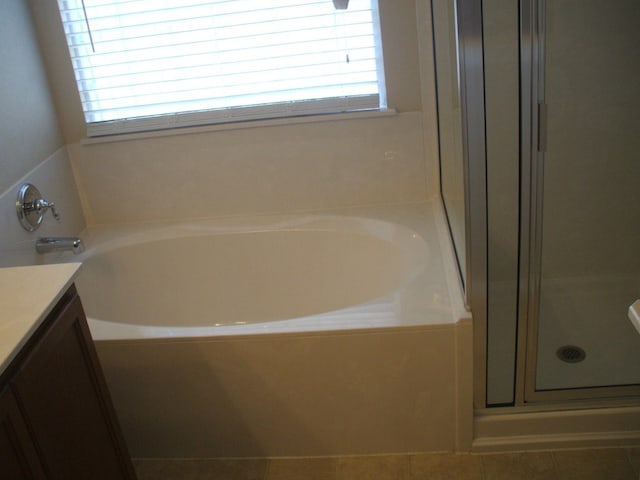 10506 Wylie Dr Unit 276, Austin, TX 78748 - full bath with vanity, a shower stall, a bath, and tile patterned flooring