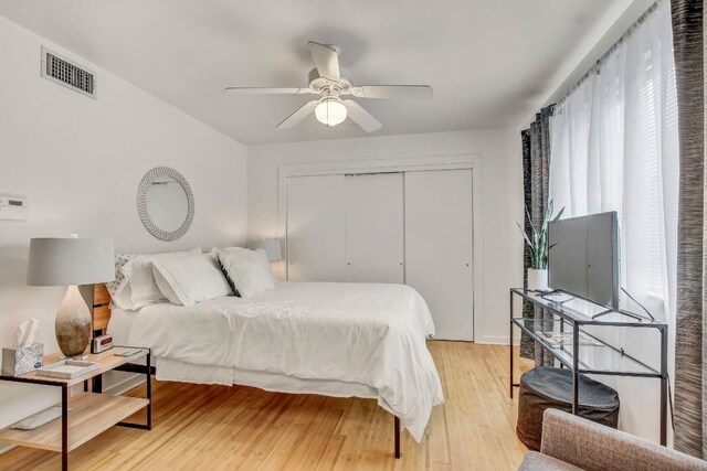 2200 Dickson Dr Unit 132, Austin, TX 78704 - bedroom with light wood finished floors, a closet, and ceiling fan