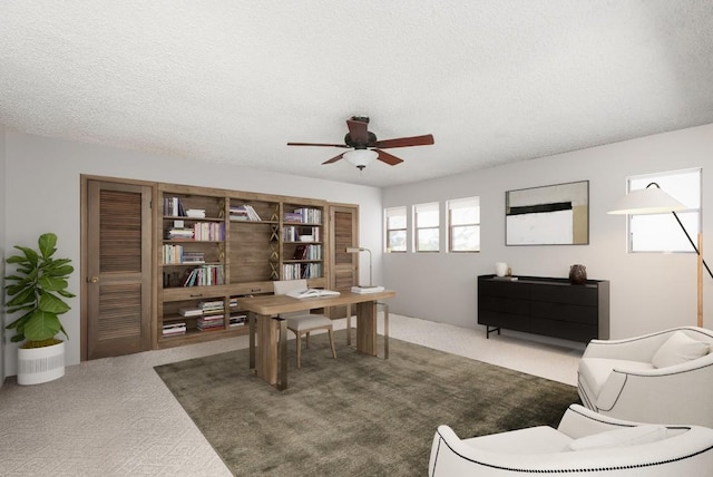 8016 Lupe Ln, Jonestown, TX 78645 - carpeted home office with a ceiling fan and a textured ceiling