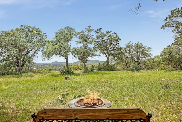 8016 Lupe Ln, Jonestown, TX 78645 - view of yard featuring a fire pit and a mountain view