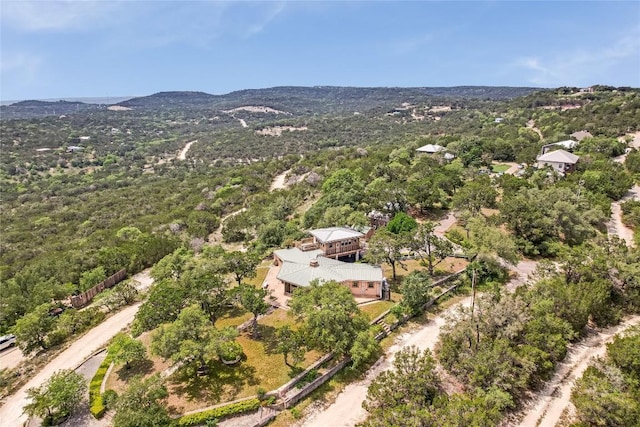 8016 Lupe Ln, Jonestown, TX 78645 - aerial view of property and surrounding area with a mountain backdrop and a forest