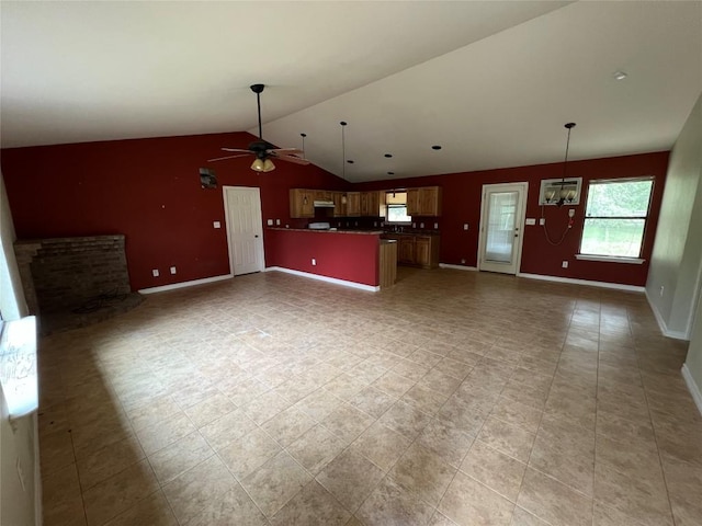 100 Acorn Trl, Cedar Creek, TX 78612 - unfurnished living room featuring a ceiling fan, vaulted ceiling, and baseboards