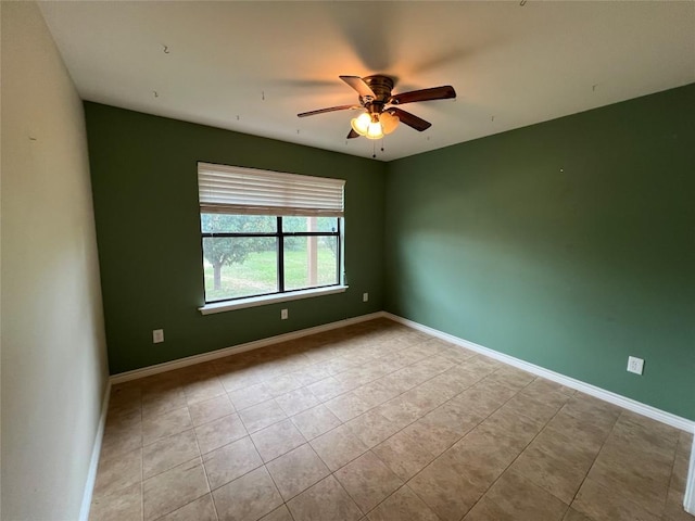 100 Acorn Trl, Cedar Creek, TX 78612 - unfurnished room with tile patterned flooring, a ceiling fan, and baseboards