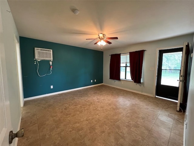 100 Acorn Trl, Cedar Creek, TX 78612 - unfurnished room featuring a ceiling fan, a wall mounted AC, and baseboards