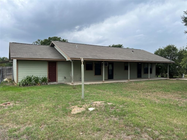 100 Acorn Trl, Cedar Creek, TX 78612 - rear view of house with a patio area and a lawn