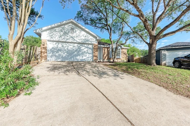 5006 Acorn Grove Ct, Austin, TX 78744 - ranch-style house with a garage and driveway