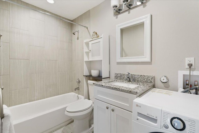 935 La Posada Dr Unit 158, Austin, TX 78752 - bathroom featuring washer / clothes dryer, vanity, and tub / shower combination