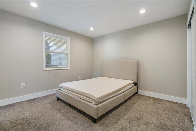 935 La Posada Dr Unit 158, Austin, TX 78752 - carpeted bedroom featuring recessed lighting and baseboards