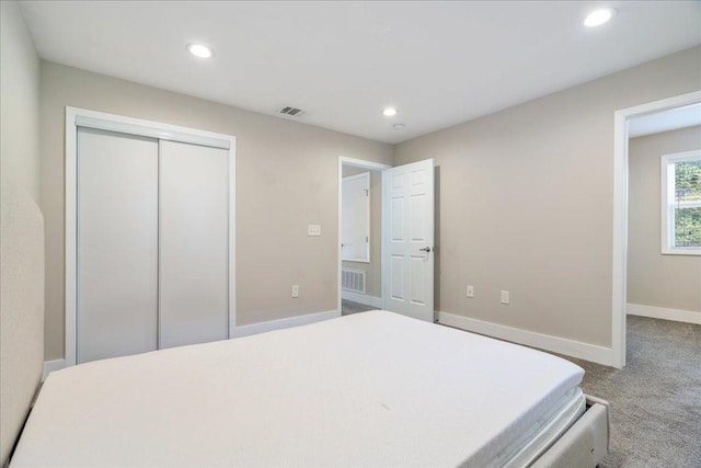 935 La Posada Dr Unit 158, Austin, TX 78752 - carpeted bedroom with recessed lighting, a closet, and baseboards