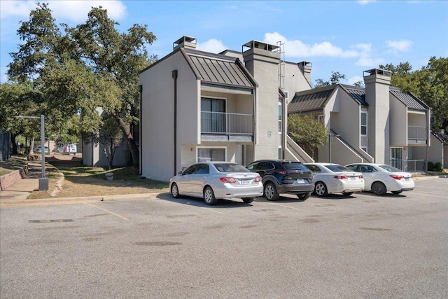 935 La Posada Dr Unit 158, Austin, TX 78752 - view of property featuring uncovered parking