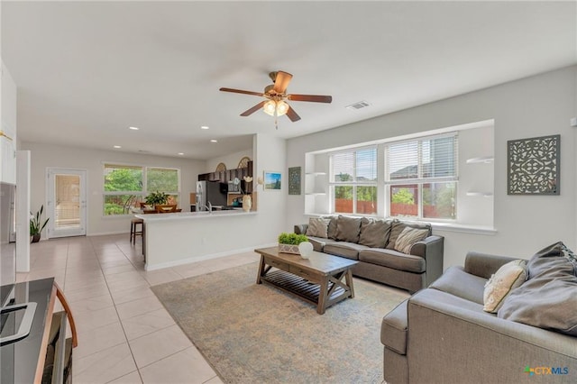 512 Canadian Springs Dr, Leander, TX 78641 - living room featuring light tile patterned floors, ceiling fan, and recessed lighting