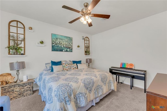 bedroom featuring carpet floors, baseboards, and ceiling fan