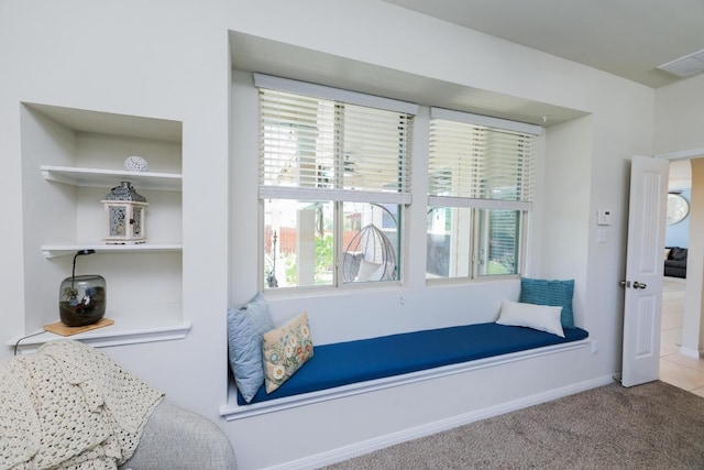 carpeted bedroom featuring baseboards