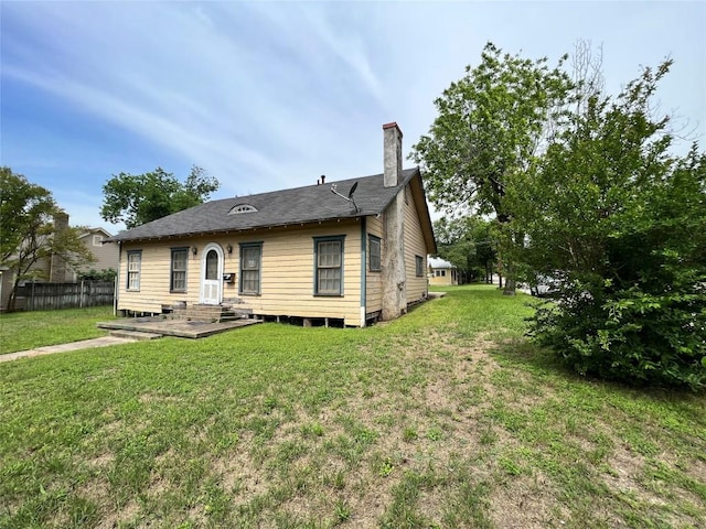 1118 N 2nd St, Temple, TX 76501 - rear view of house featuring a chimney