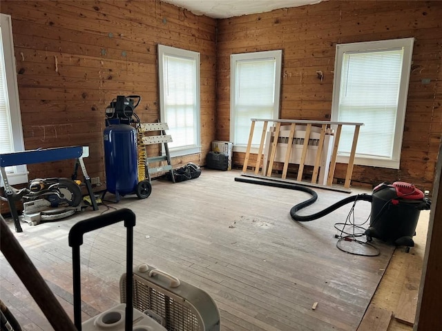 1118 N 2nd St, Temple, TX 76501 - workout room featuring hardwood / wood-style flooring and wooden walls