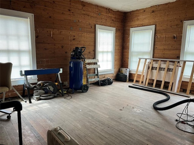 1118 N 2nd St, Temple, TX 76501 - bedroom with hardwood / wood-style flooring and wood walls