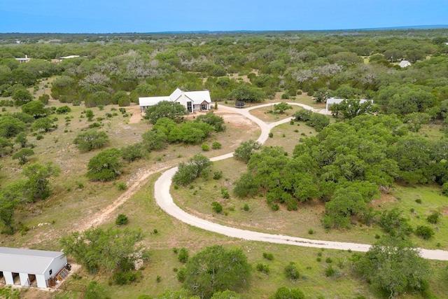 1433 Althaus Ranch Rd, Johnson City, TX 78636 - aerial view of property and surrounding area featuring a heavily wooded area