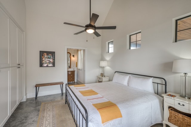 1433 Althaus Ranch Rd, Johnson City, TX 78636 - bedroom featuring high vaulted ceiling, concrete floors, a ceiling fan, baseboards, and connected bathroom