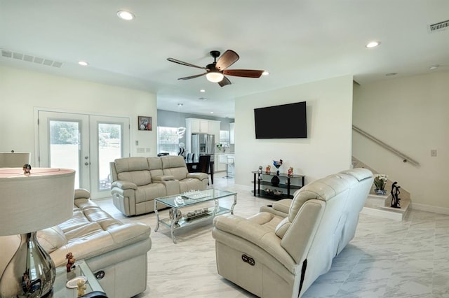 2409 Pecan St, Bastrop, TX 78602 - living area featuring light marble finish floors, a ceiling fan, recessed lighting, french doors, and baseboards