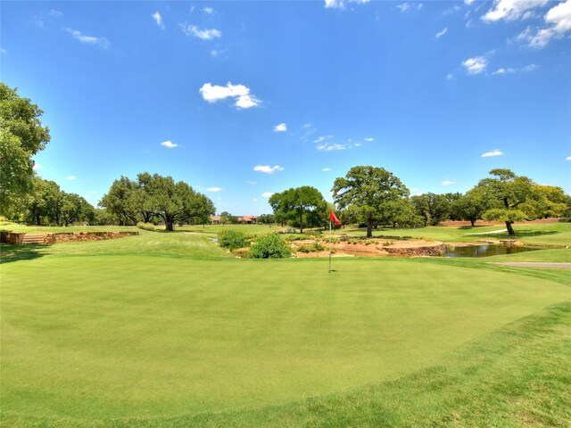 305 Indigo Ln, Georgetown, TX 78628 - view of property's community featuring golf course view, a water view, a putting area, and a lawn