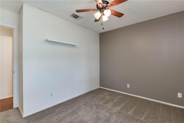 7309 Whispering Oaks Dr, Austin, TX 78745 - spare room featuring a ceiling fan, carpet flooring, a textured ceiling, and baseboards