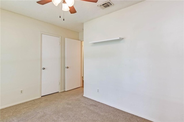 7309 Whispering Oaks Dr, Austin, TX 78745 - unfurnished bedroom with light carpet and a ceiling fan