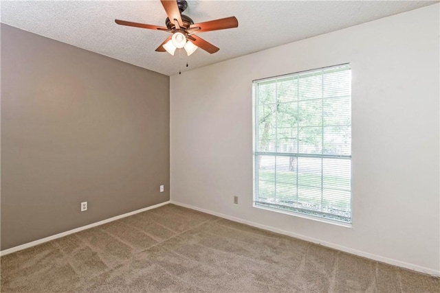 7309 Whispering Oaks Dr, Austin, TX 78745 - unfurnished room featuring carpet flooring, a ceiling fan, and a textured ceiling