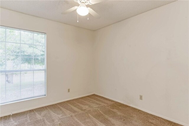 7309 Whispering Oaks Dr, Austin, TX 78745 - empty room with light colored carpet and a ceiling fan