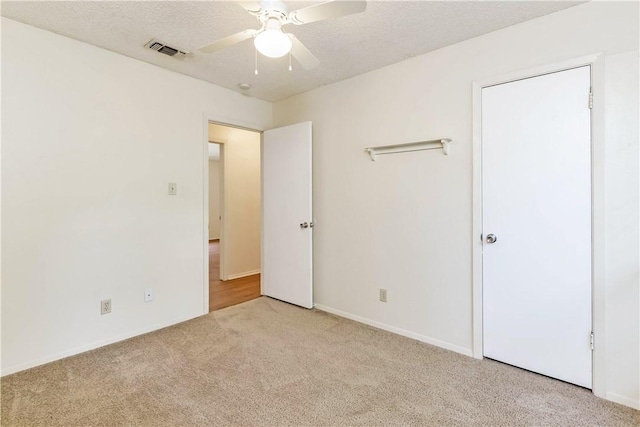 7309 Whispering Oaks Dr, Austin, TX 78745 - unfurnished bedroom featuring carpet and a ceiling fan