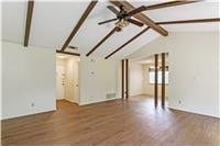7309 Whispering Oaks Dr, Austin, TX 78745 - unfurnished living room featuring wood finished floors