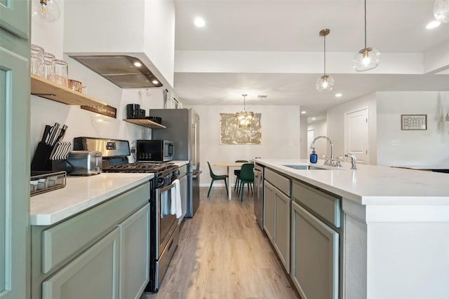 306 Juarez St, San Marcos, TX 78666 - kitchen featuring stainless steel appliances, a sink, open shelves, light wood-style floors, and wall chimney exhaust hood