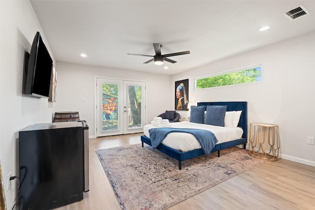 306 Juarez St, San Marcos, TX 78666 - bedroom with access to exterior, light wood-style floors, french doors, recessed lighting, and baseboards