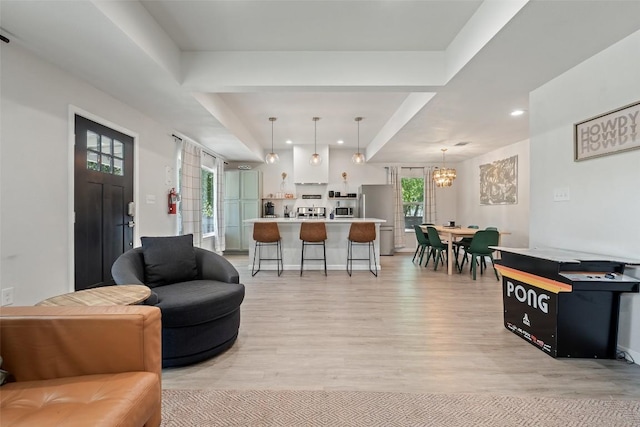 306 Juarez St, San Marcos, TX 78666 - living area with light wood-style flooring, a chandelier, and recessed lighting