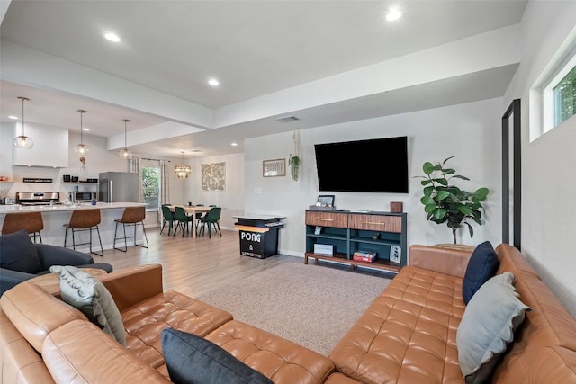 306 Juarez St, San Marcos, TX 78666 - living room featuring light wood finished floors, recessed lighting, and baseboards