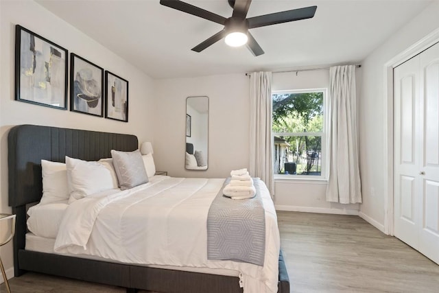 306 Juarez St, San Marcos, TX 78666 - bedroom featuring wood finished floors, baseboards, and ceiling fan