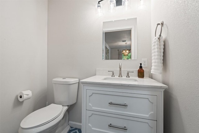 306 Juarez St, San Marcos, TX 78666 - half bathroom featuring vanity and toilet