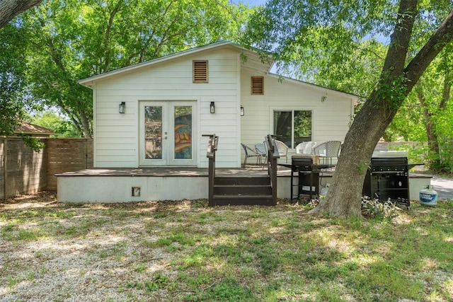 306 Juarez St, San Marcos, TX 78666 - rear view of house featuring a deck and fence
