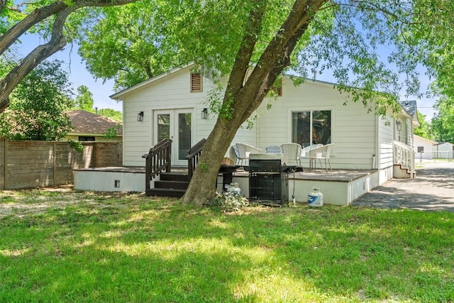 306 Juarez St, San Marcos, TX 78666 - rear view of property featuring french doors and a deck